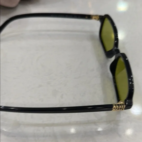 Miu Miu Black Sunglasses with Yellow Tint display picture 1